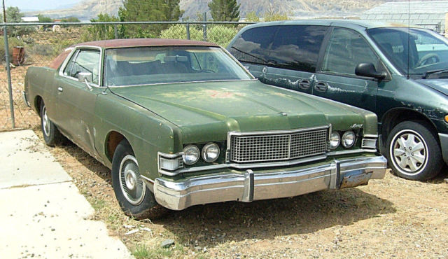 1973 Mercury Grand Marquis had white vinyl roof at one time...