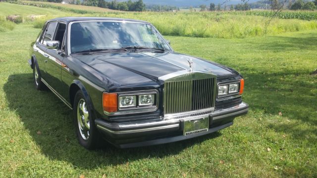 1991 ROLLS ROYCE SILVER SPIRIT II BLACK CONNELY LEATHER W/RED PIPING