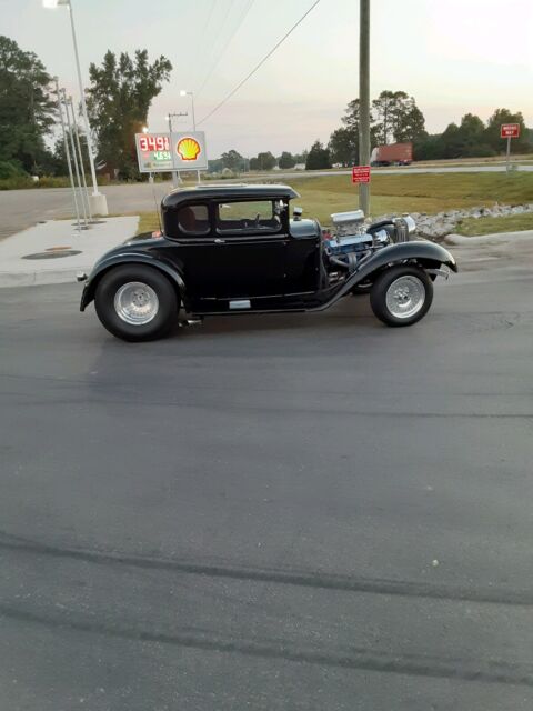 1931 Ford 5 window coupe. silver