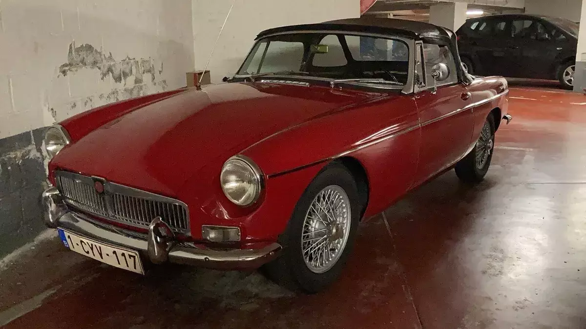 1964 MG B red with chrome, interior is black with red pinstripes