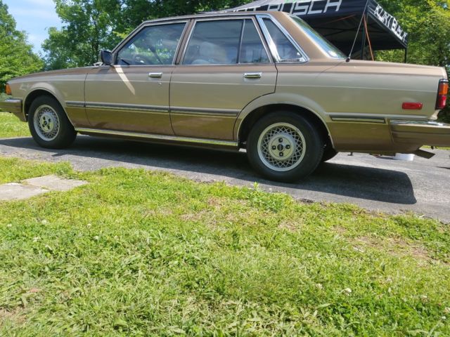 1982 Toyota Cressida Gold and tan/beige on brown