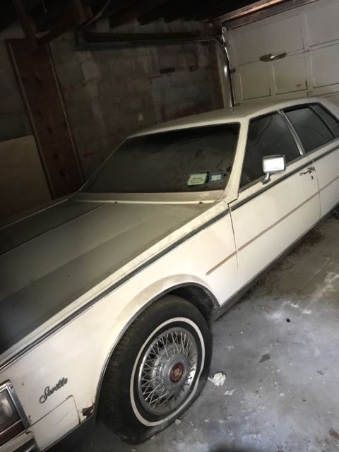 1985 Cadillac Seville Burgundy Leather Interior, White Exterior