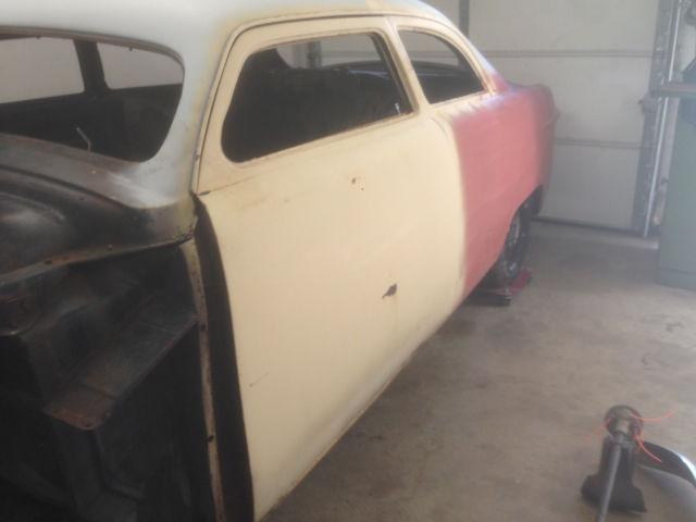 1951 Ford Tudor Sedan Ha!  None except window moldings