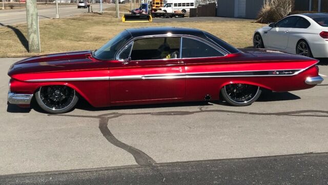 1961 Chevrolet Impala Candy red & black. Lots of chrome